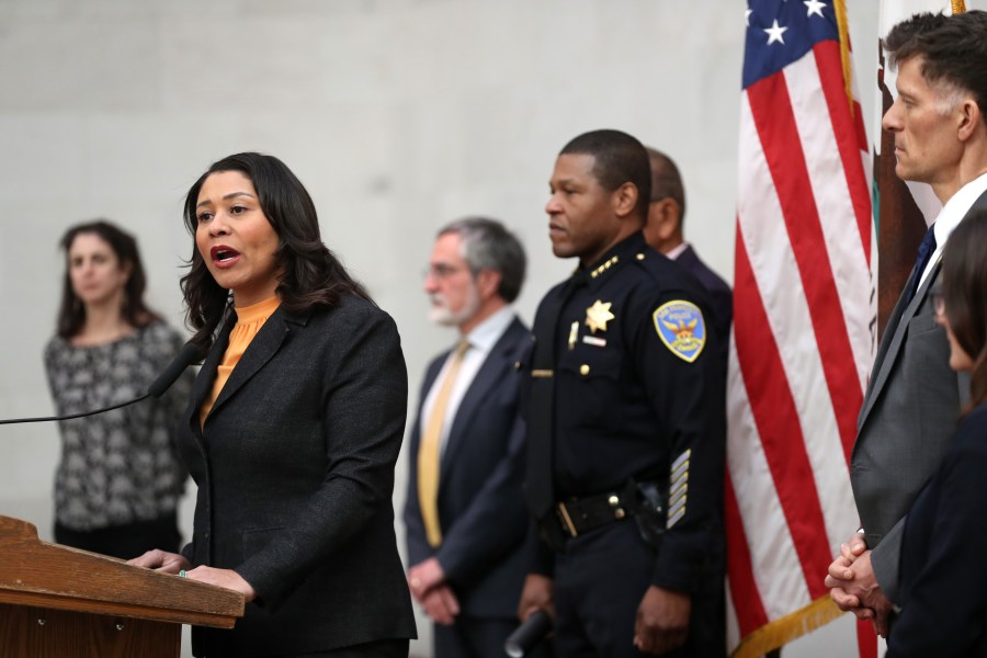 San Francisco Mayor London Breed speaks during a press conference as San Francisco police chief William Scott looks on at San Francisco City Hall on March 16, 2020, in San Francisco. (Justin Sullivan/Getty Images)