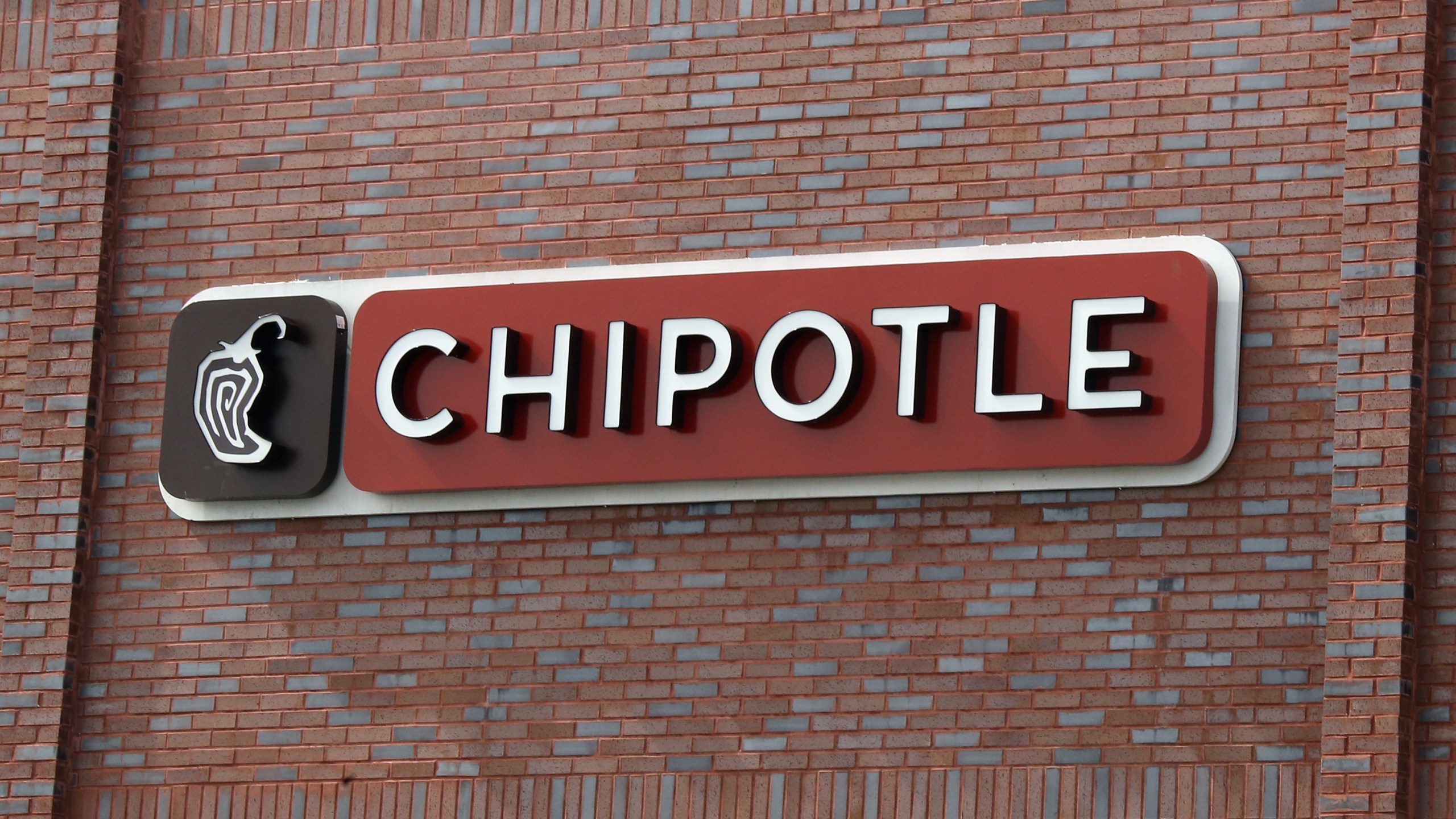 A sign for Chipotle is seen in a file photo. (Bruce Bennett/Getty Images)