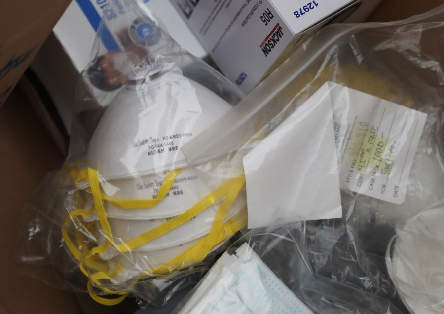 Police lead a donation drive to collect medical equipment such as N95 surgical masks, nitrile gloves, Tyvek suits and disinfecting wipes in East Meadow, New York, on March 24, 2020. (Credit: Al Bello / Getty Images)