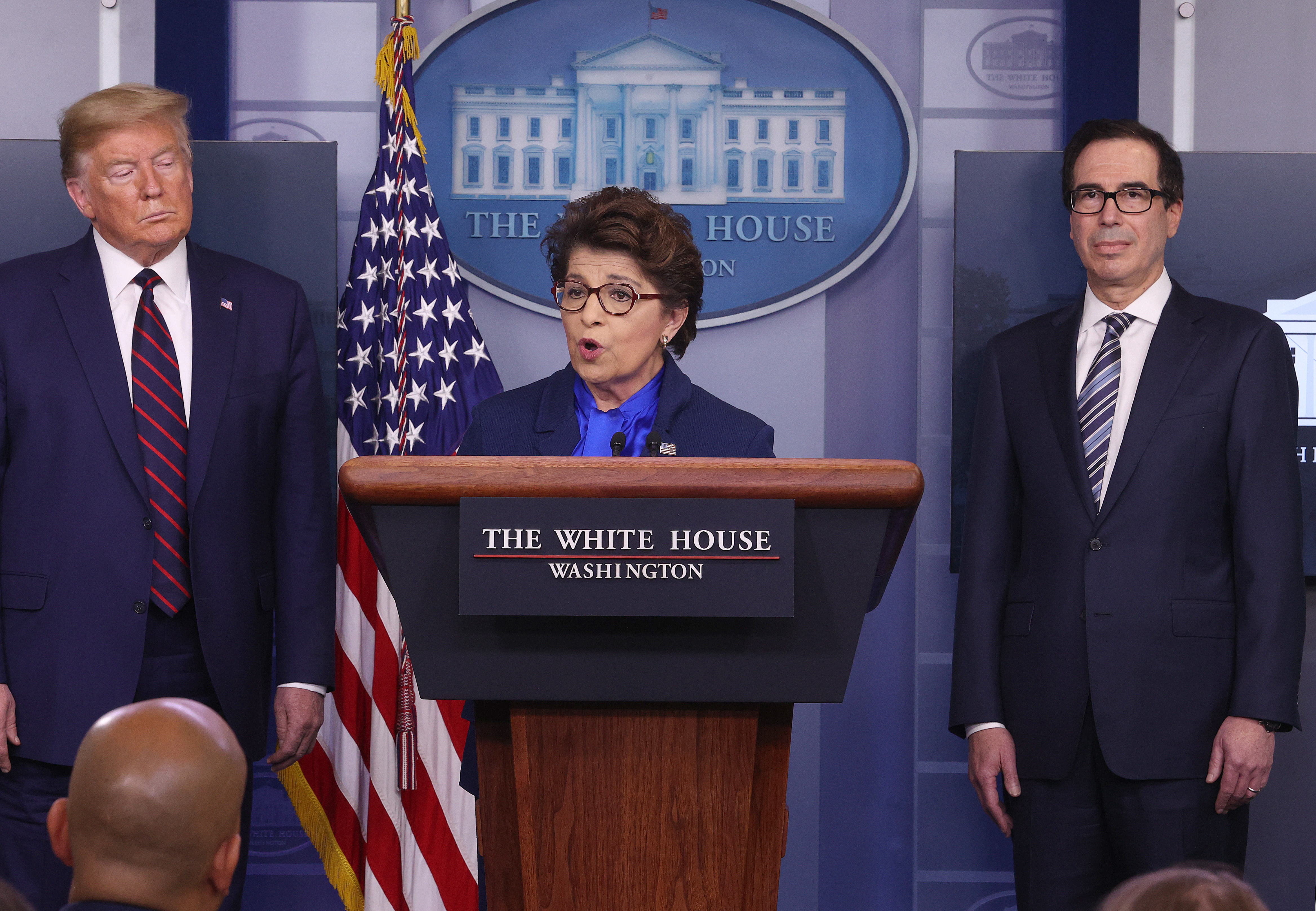 Small Business Administrator Jovita Carranza speaks while flanked by U.S. President Donald Trump and Secretary of Treasury Steve Mnuchin in the press briefing room with members of the White House Coronavirus Task Force on April 2, 2020 in Washington, D.C. (Win McNamee/Getty Images)