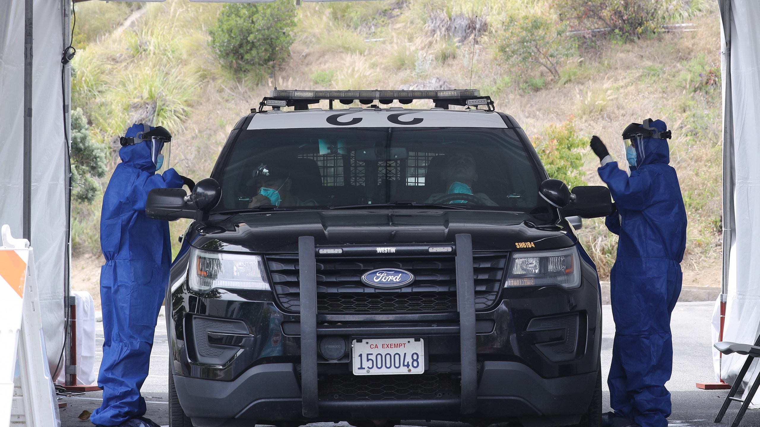 A police cruiser is seen at a drive-through coronavirus testing site at Malibu City Hall on April 8, 2020. (Mario Tama/Getty Images)