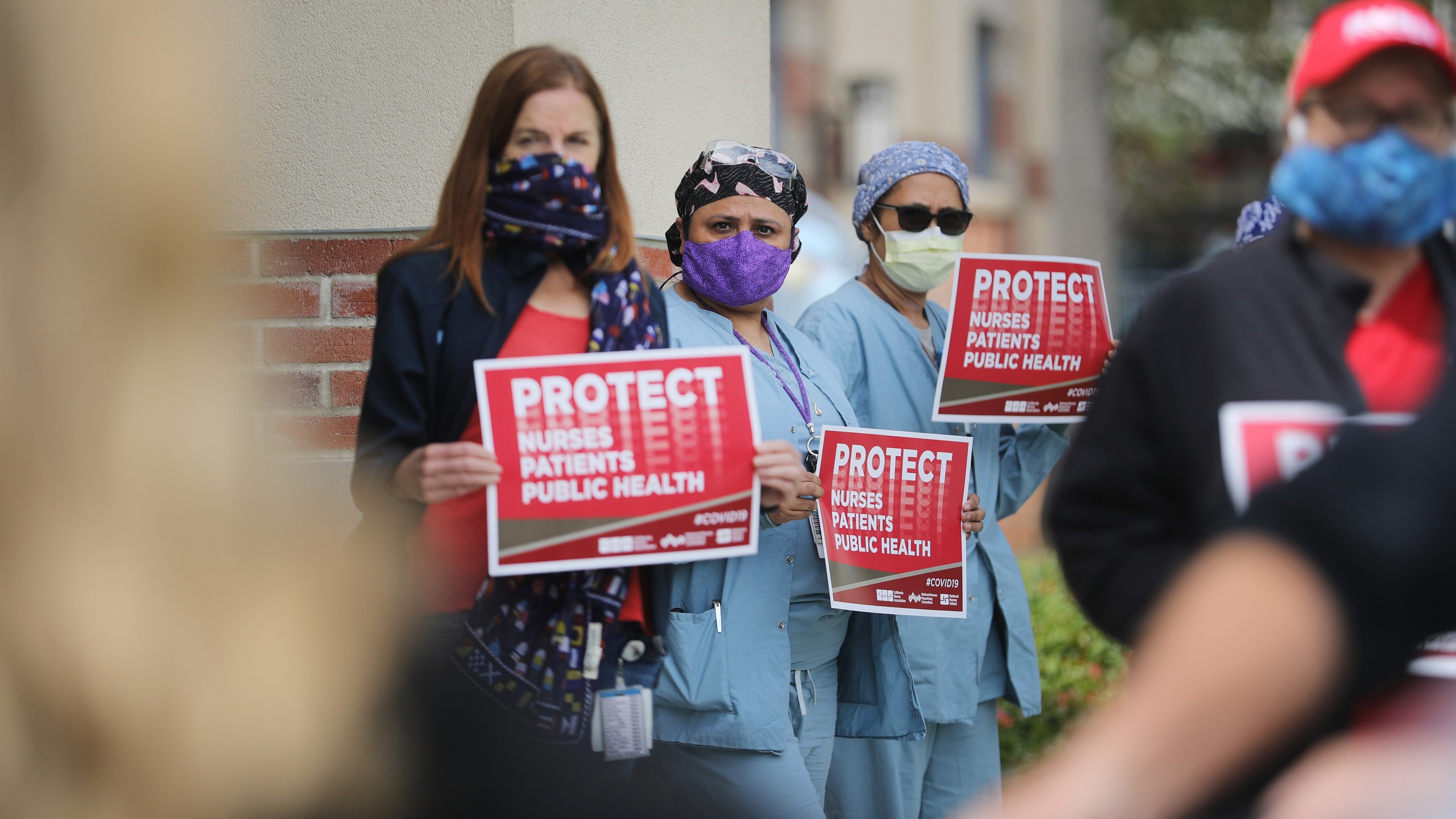 Registered nurses and health care workers protest what they say is a lack of personal protective equipment (PPE) available for frontline workers at UCLA Medical Center, Santa Monica amid the coronavirus pandemic on April 13, 2020, in Santa Monica, California. (Mario Tama/Getty Images)