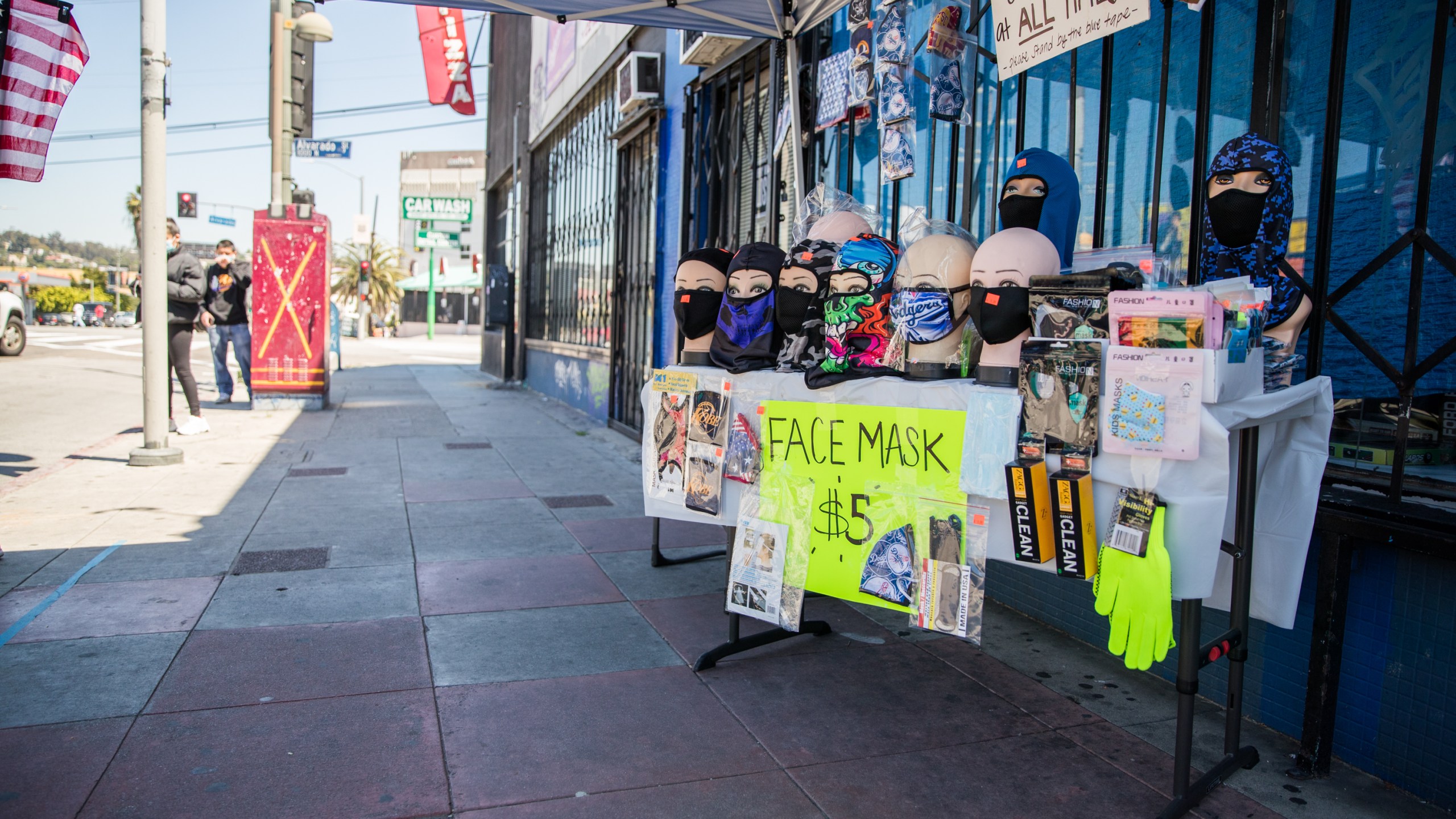 A street vendor sells face masks from a pop up stand on April 15, 2020, in Los Angeles, California. (Rich Fury/Getty Images)