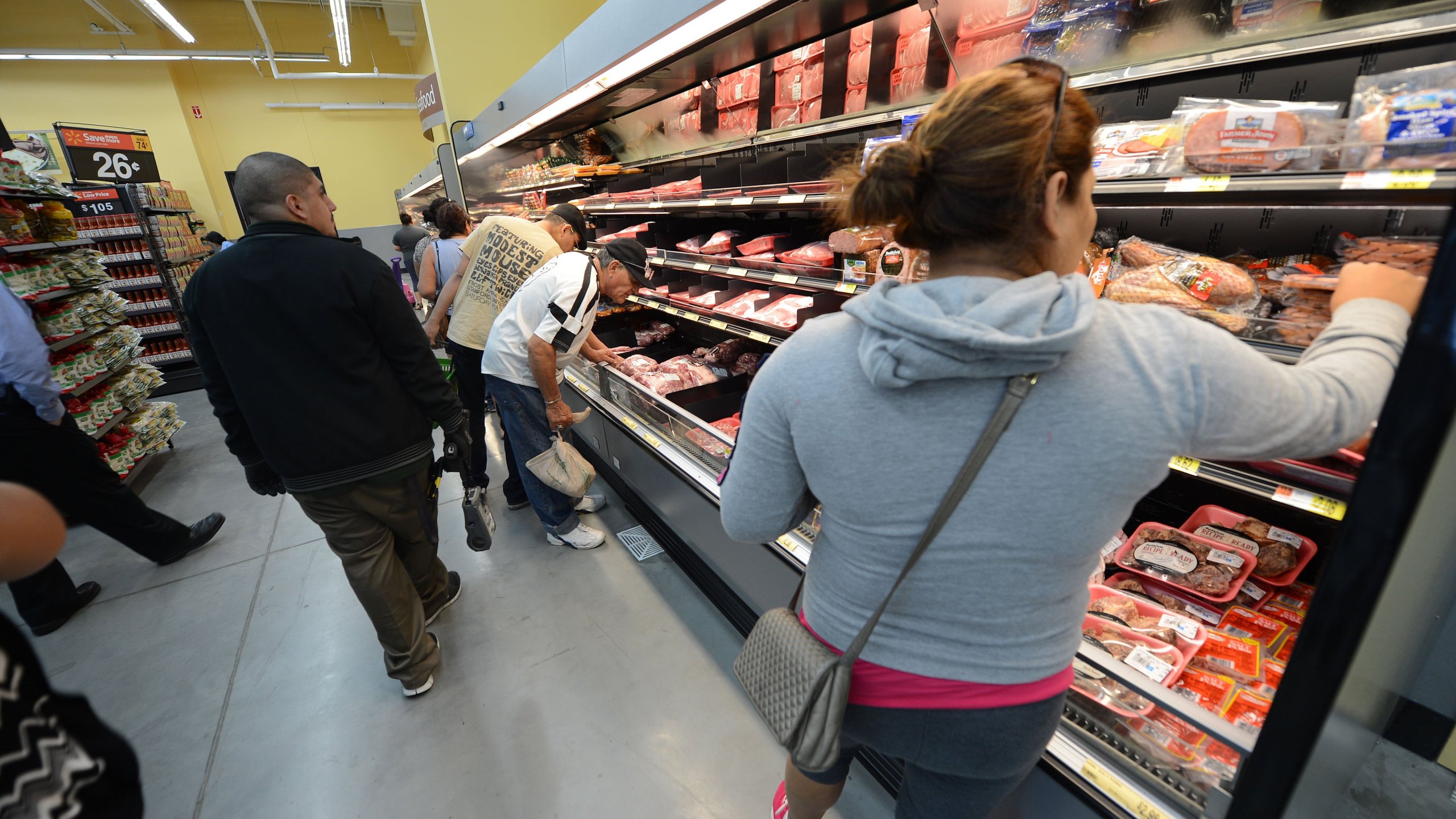 People shop for meat on the opening day of the new Walmart Neighborhood Market in Panorama City, California, on Sept. 28, 2012. (ROBYN BECK/AFP/GettyImages)