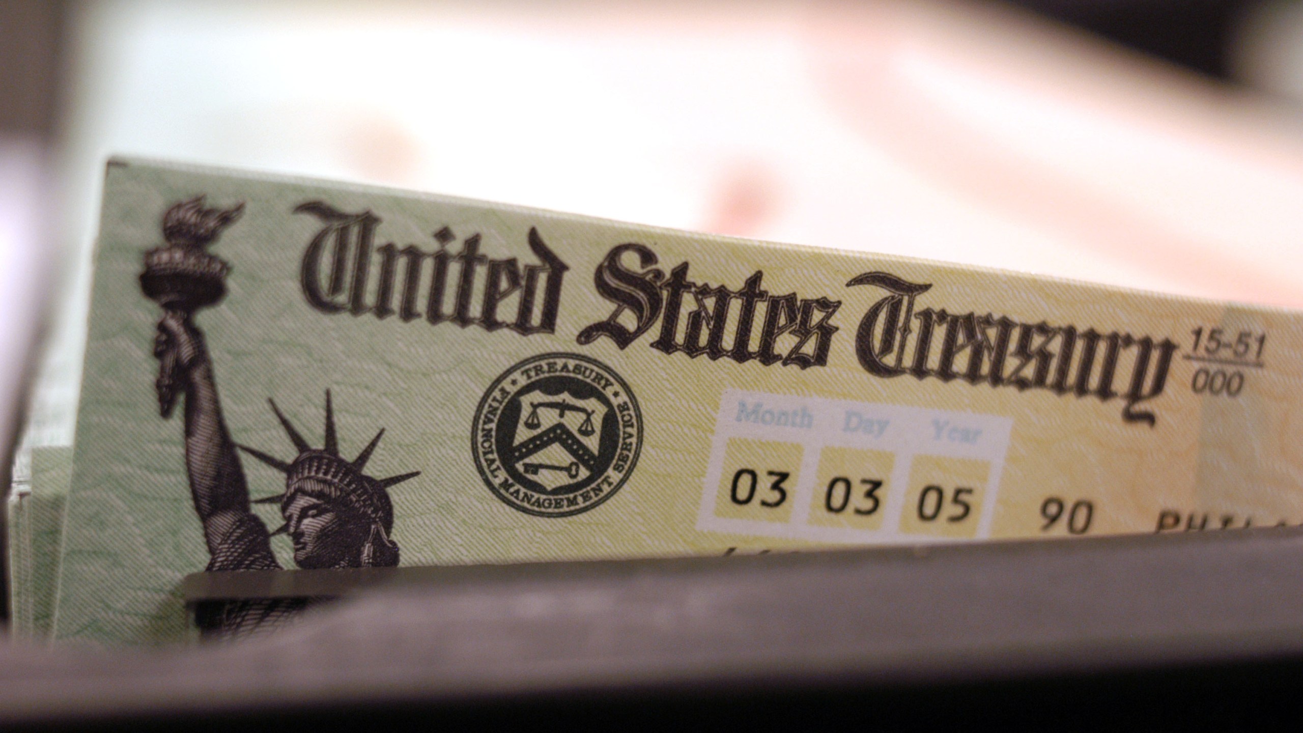 Blank Social Security checks are run through a printer at the U.S. Treasury printing facility February 11, 2005 in Philadelphia, Pennsylvania. (William Thomas Cain/Getty Images)