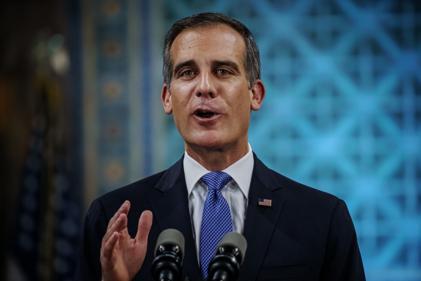 Mayor Eric Garcetti delivers his State of the City address Sunday night in a nearly empty City Council chamber on April 19, 2020. (Marcus Yam/Los Angeles Times)