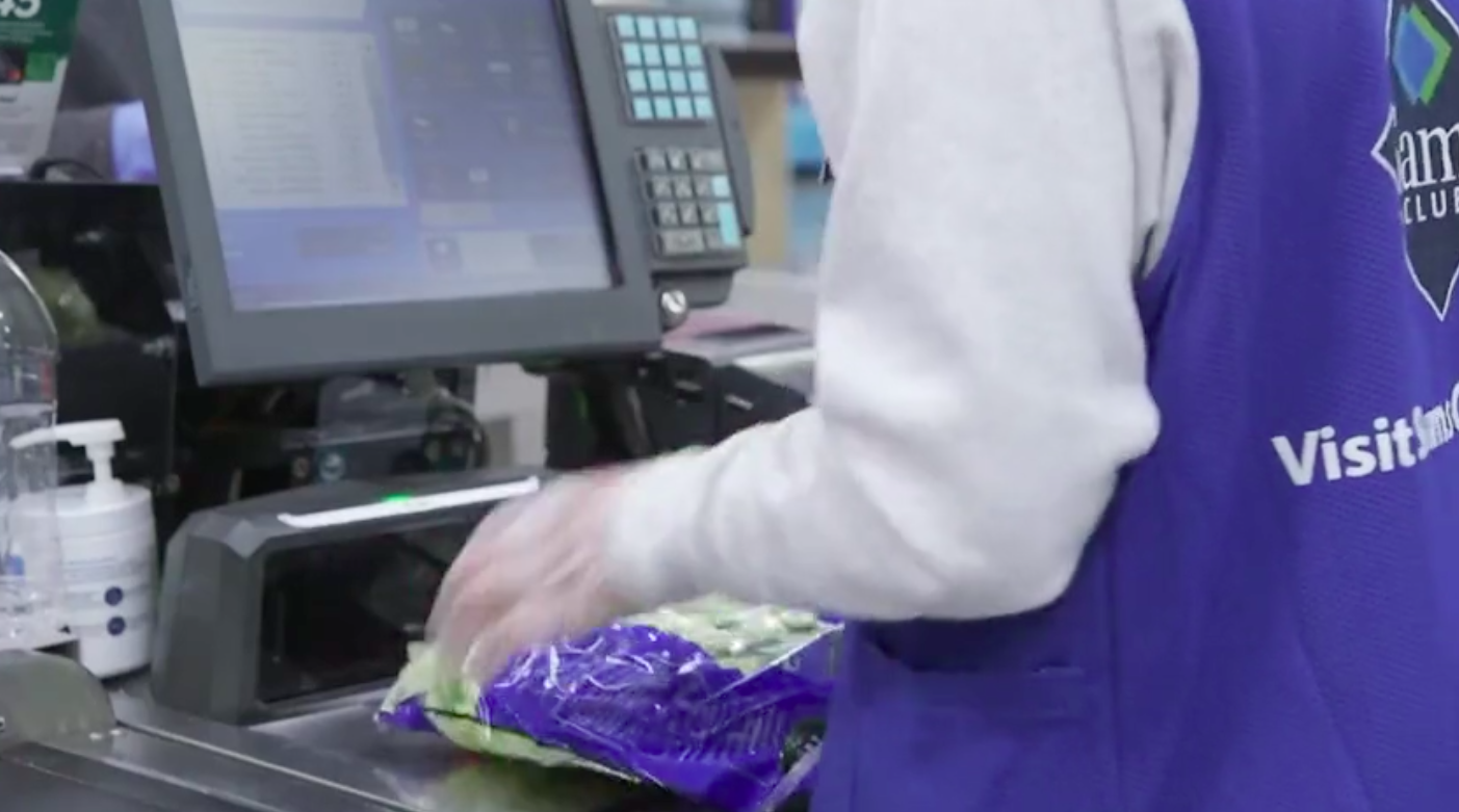 A grocery store employee bags groceries in this undated photo. (Sam's Club)