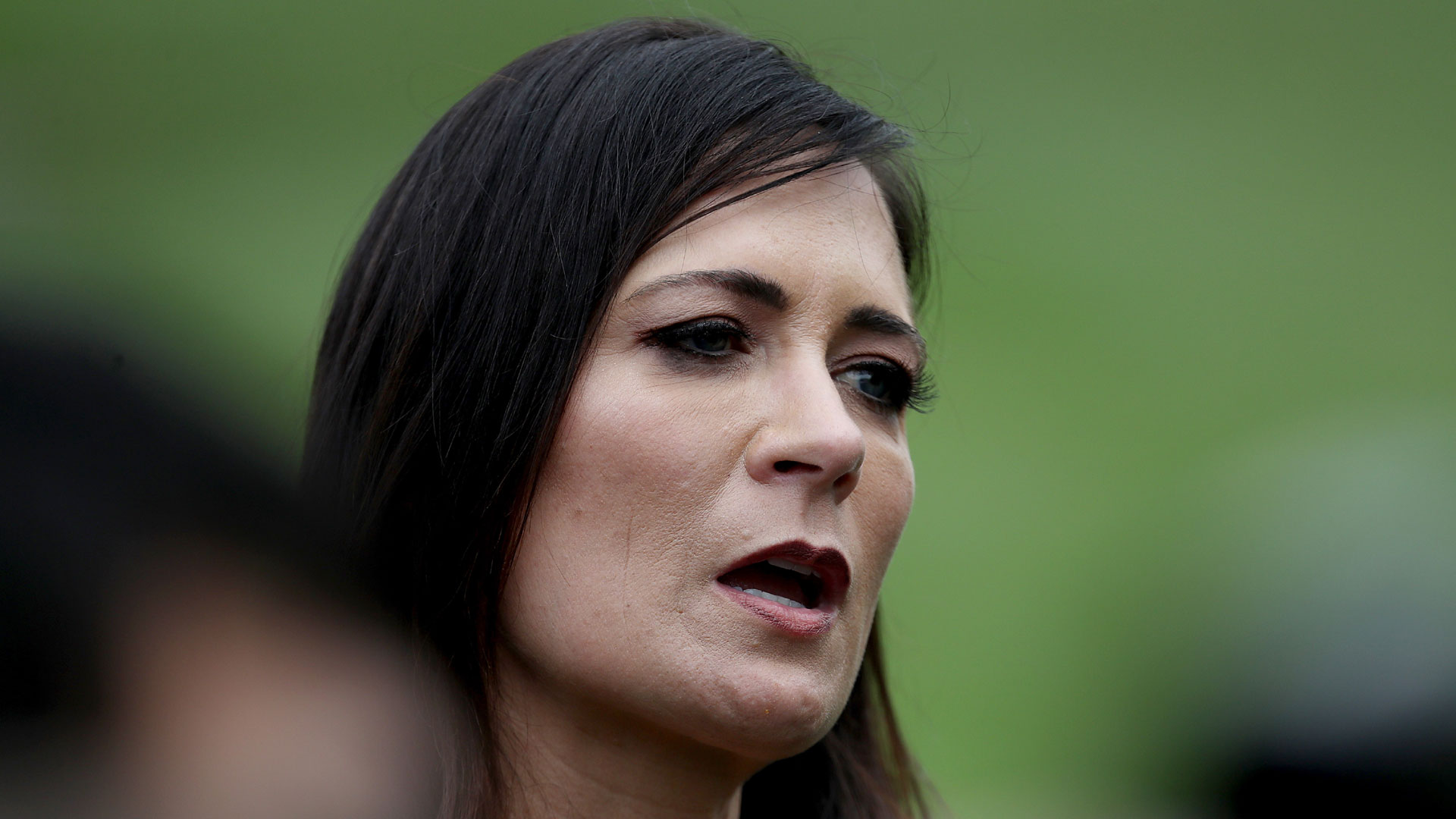 White House press secretary Stephanie Grisham listens as U.S. President Donald Trump speaks to members of the press at the White House before departing on Sept. 9, 2019, in Washington, DC. (Win McNamee/Getty Images)