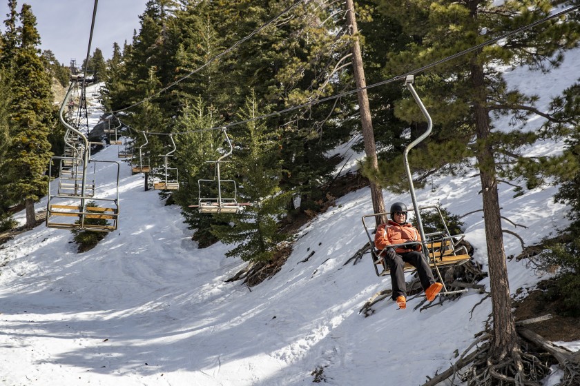 A rider is seen in a lift at Mt. Baldy in this file photo. (Brian van der Brug / Los Angeles Times)