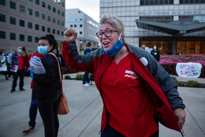 Marsha Santini, a RN at UCLA Medical Center, along with fellow nurses protest the lack of personal protective equipment (PPE) for frontline health care workers at the UCLA Ronald Regan Medical Center in Los Angeles.(Jason Armond / Los Angeles Times)