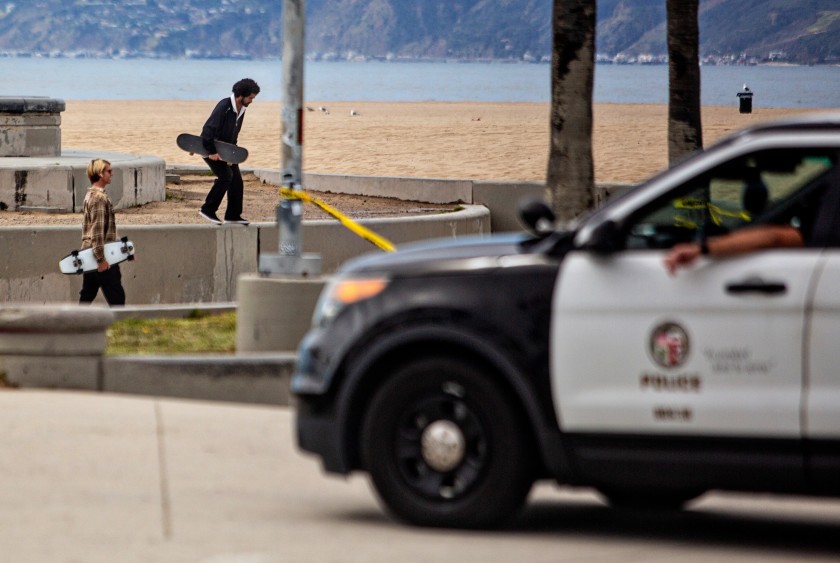 LAPD clears people from using the skate park at Venice Beach during the coronavirus pandemic on Monday in Venice Beach. (Jason Armond/Los Angeles Times)