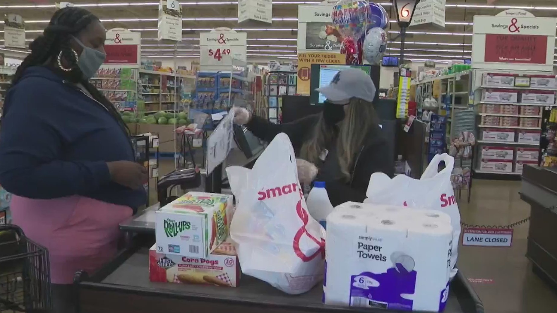 A shopper who had her groceries paid for by the Dodgers is seen at a Smart & Final in South Los Angeles on April 23, 2020.