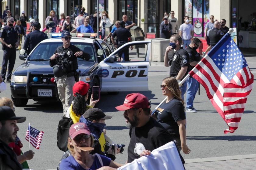 Demonstrators rally last week in Huntington on April 17, 2020. (Irfan Khan / Los Angeles Times)