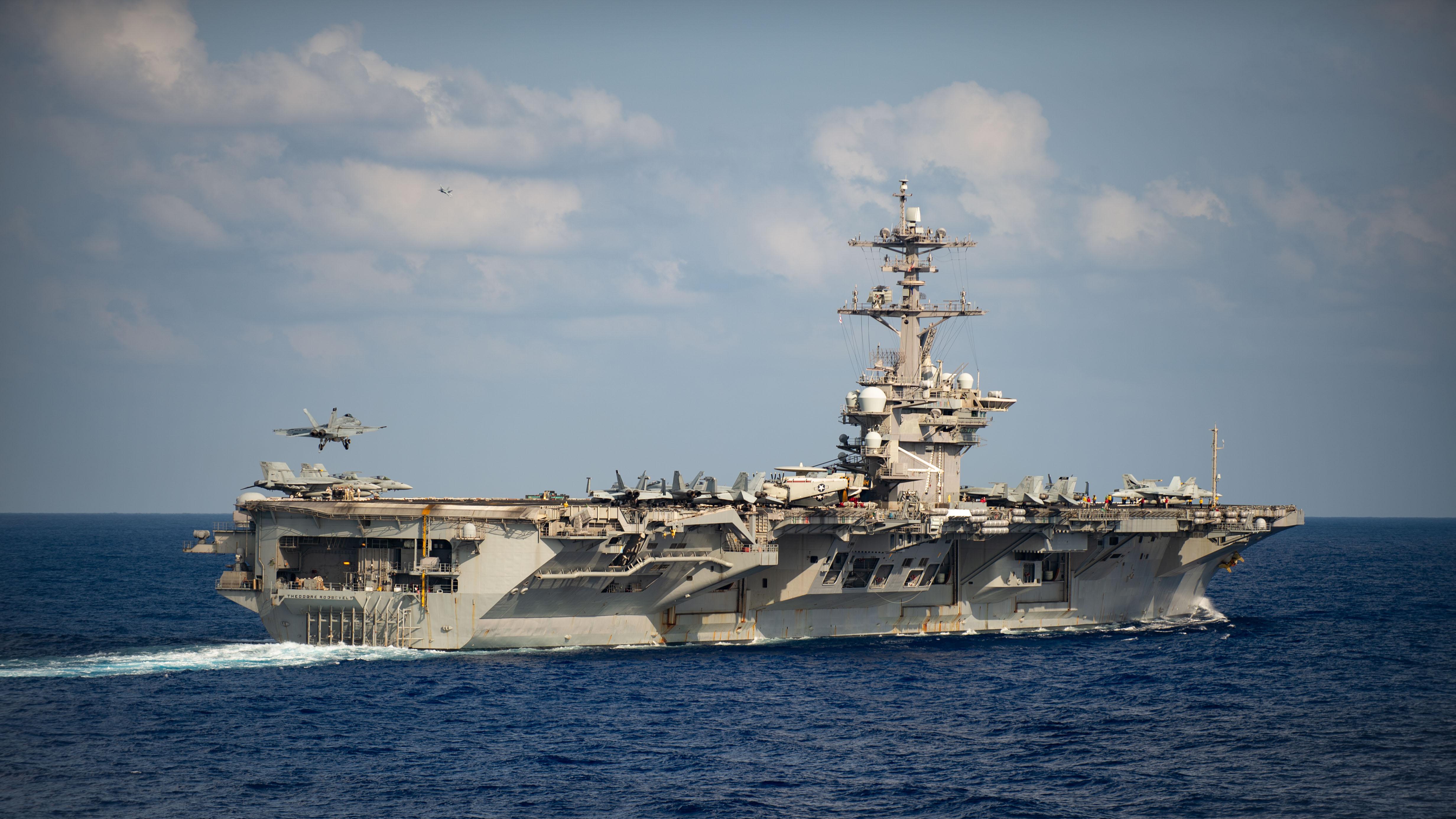 An F/A-18F Super Hornet, assigned to the Black Knights of Strike Fighter Squadron 154, lands on the flight deck of the aircraft carrier USS Theodore Roosevelt, March 18, 2020. (U.S. Navy photo by Mass Communication Specialist 3rd Class Nicholas V. Huynh/Released)