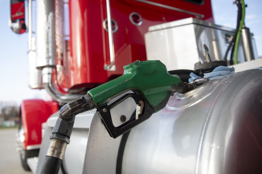 A filler nozzle pumps fuel into the gas tank of a tractor trailer in a file photo. (Daniel Acker/Bloomberg/Getty Images)