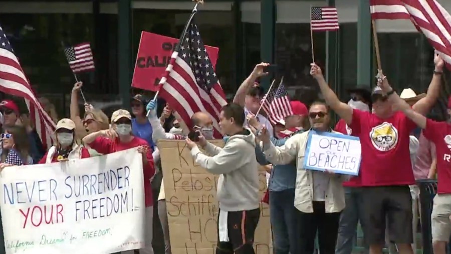 Protesters gather to rally against California's stay-at-home order during the coronavirus pandemic on April 18, 2020. (Credit: KSWB)