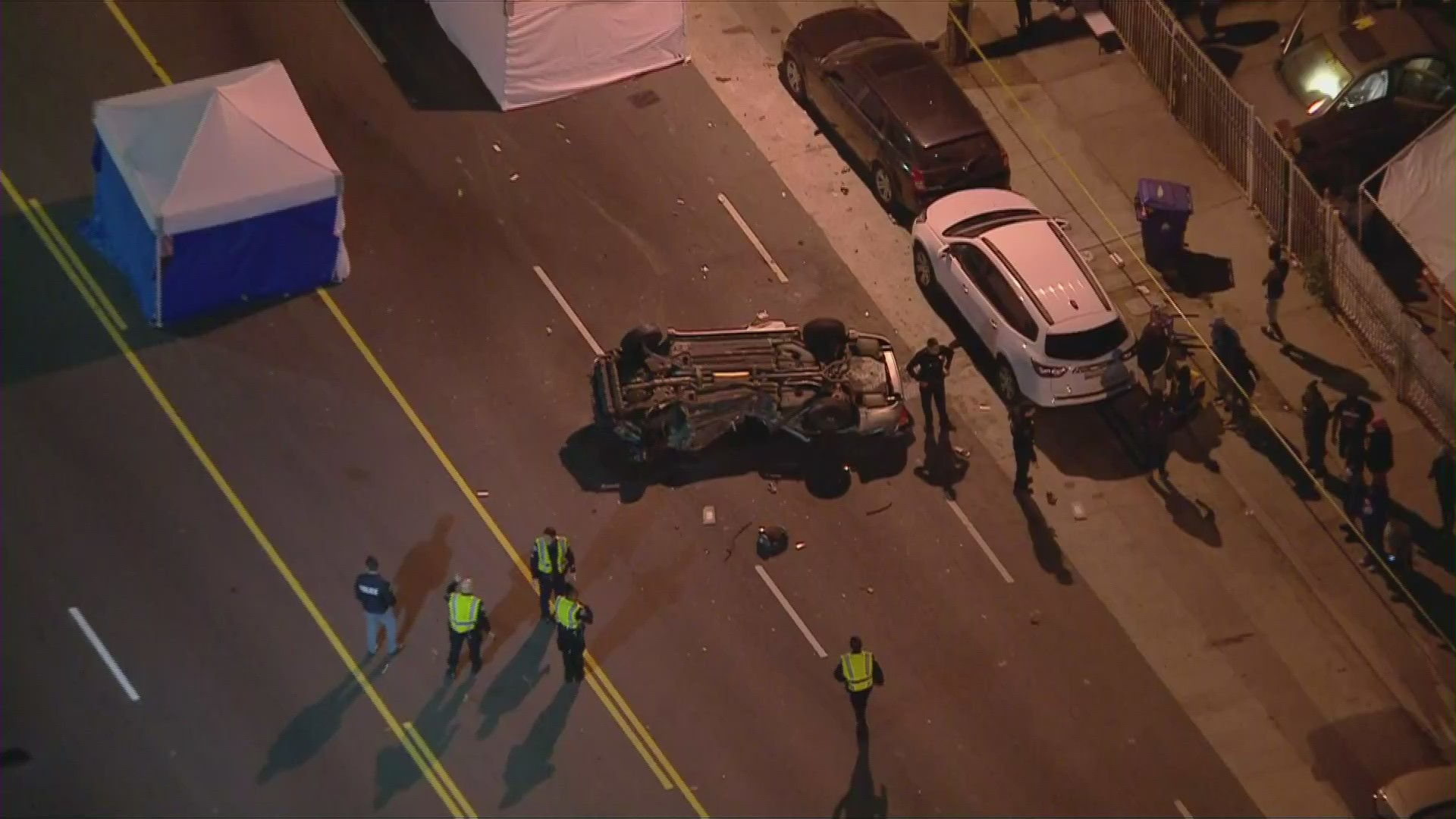 Investigators respond to the scene of a car crash that killed three people in the Willowbrook area on May 1, 2020. (Credit: KTLA)