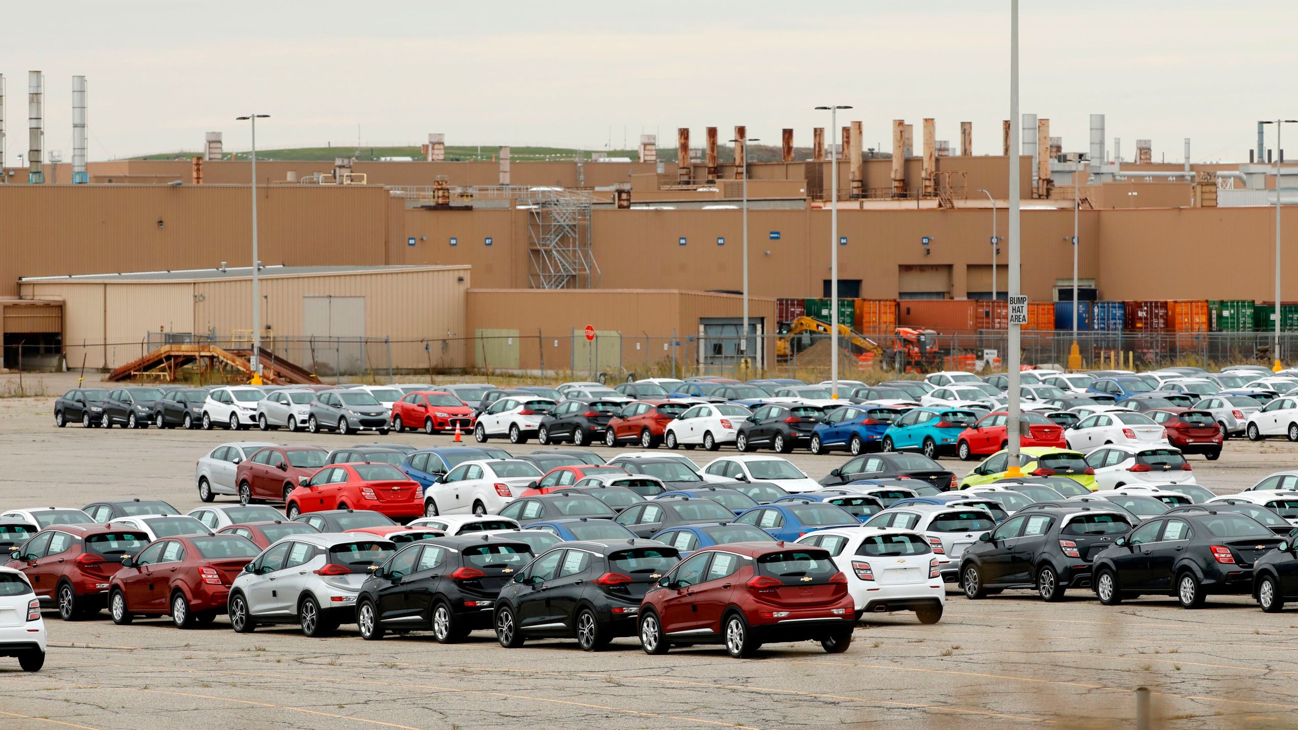 Cheverlot Sonic and Bolt EV vehicles sit in the lot outside General Motors (GM) Orion Assembly on October 11, 2019 in Orion Township, Michigan. (JEFF KOWALSKY/AFP via Getty Images)