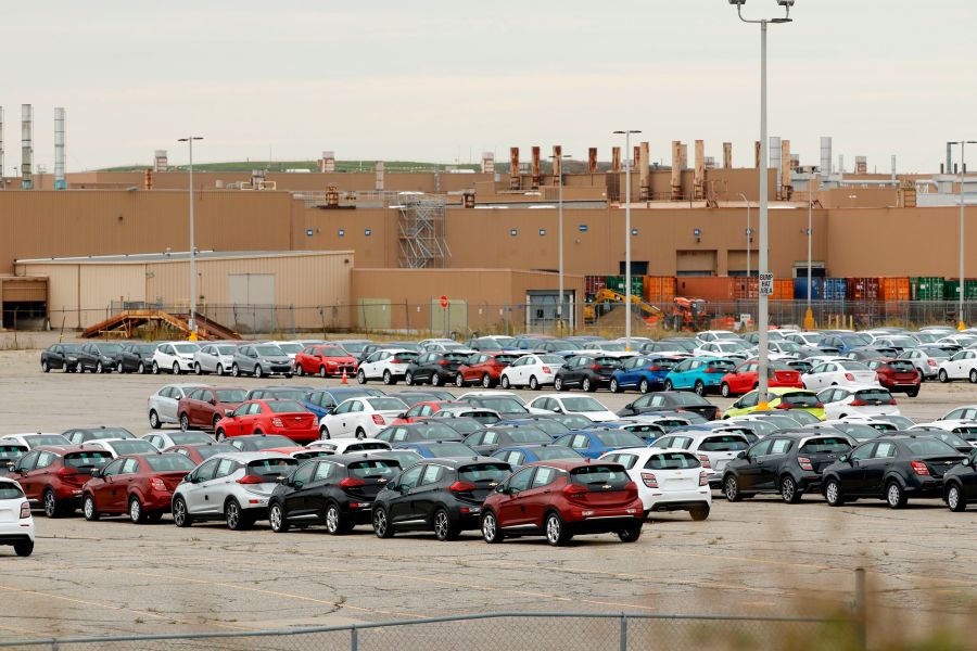 Cheverlot Sonic and Bolt EV vehicles sit in the lot outside General Motors (GM) Orion Assembly on October 11, 2019 in Orion Township, Michigan. (JEFF KOWALSKY/AFP via Getty Images)