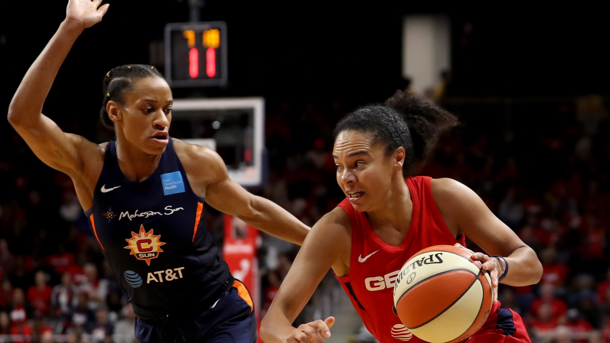 Kristi Toliver of Washington Mystics drives against Jasmine Thomas of Connecticut Sun during Game Five of the 2019 WNBA Finals at St Elizabeths East Entertainment & Sports Arena on October 10, 2019, in Washington, DC. (Rob Carr/Getty Images)