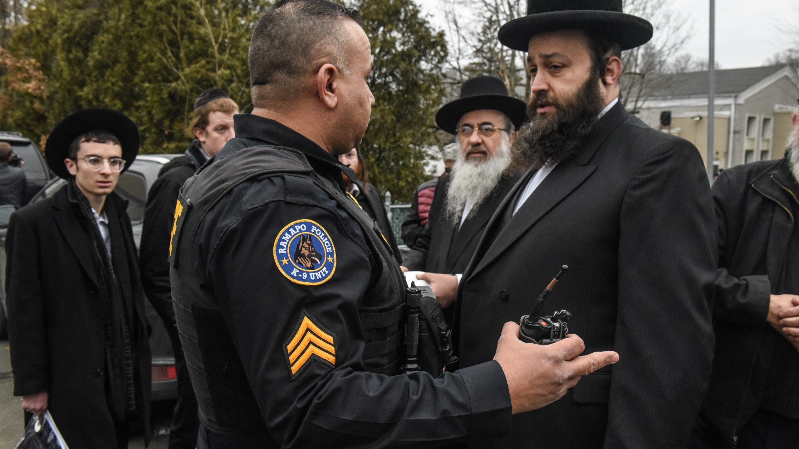 A Ramapo police officer stands guard in front of the house of Rabbi Chaim Rottenberg in Monsey, New York, on Dec. 29, 2019, after five people were injured in a knife attack. (Stephanie Keith / Getty Images)