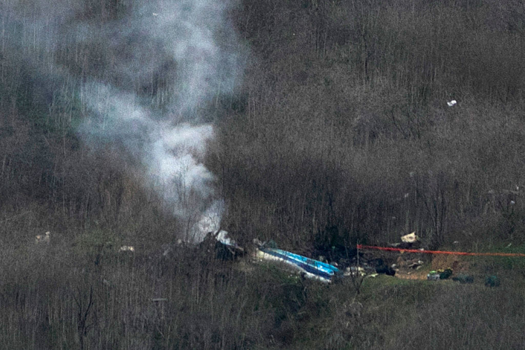 Wreckage of the crashed helicopter that was carrying former NBA star Kobe Bryant and his 13-year-old daughter Gianna smolders on the ground on January 26, 2020 in Calabasas, California. According to reports, five people including Bryant and his daughter have been confirmed killed in the crash. (Photo by David McNew/Getty Images)