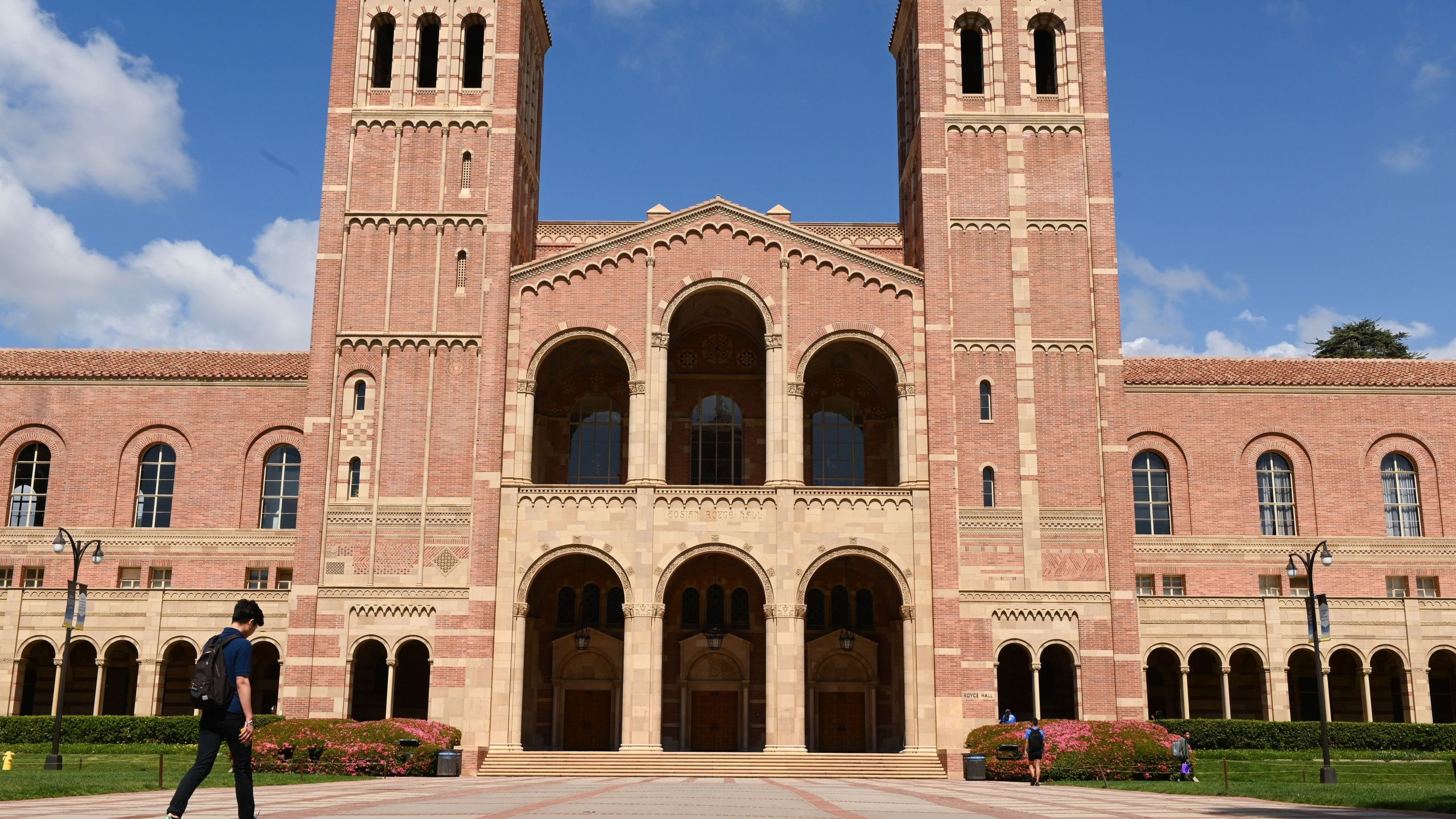 A student walks toward Royce Hall on the campus of University of California at Los Angeles on March 11, 2020. (ROBYN BECK/AFP via Getty Images)