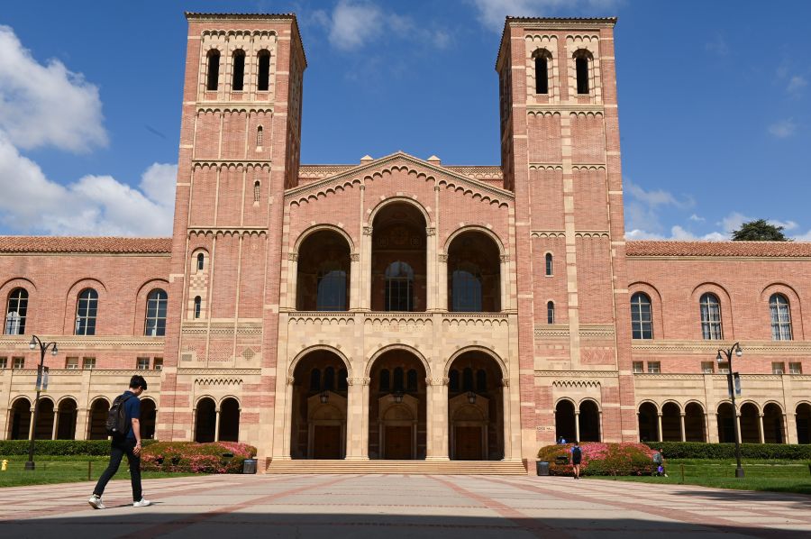 A student walks toward Royce Hall on the campus of University of California at Los Angeles on March 11, 2020. (ROBYN BECK/AFP via Getty Images)