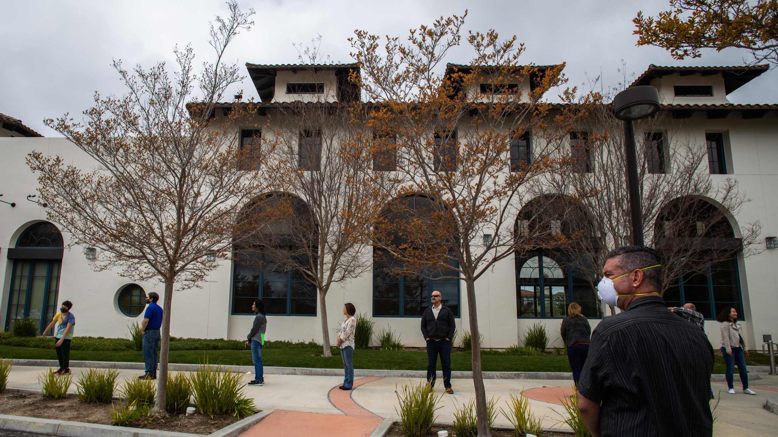 People wait in line to get into the Godspeaker Calvary Chapel sanctuary in Thousand Oaks to take communion after watching Palm Sunday Service on April 5, 2020. (APU GOMES/AFP via Getty Images)