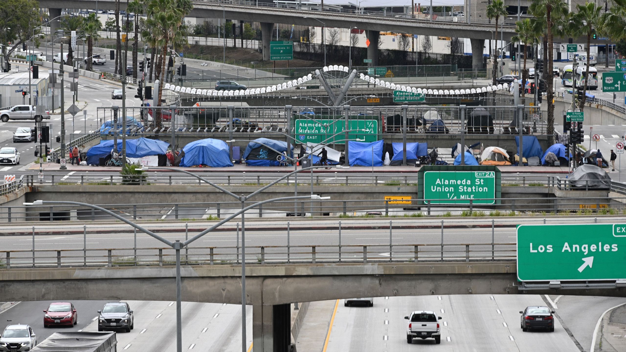 A row of tents for the homeless are seen above a Los Angeles freeway on April 7, 2020. (Robyn Beck/AFP via Getty Images)