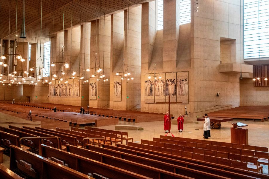 Archbishop Jose Gomez (left), Father Brian Nunez (center) and Father Raymont Medina celebrate Good Friday liturgy in an empty Cathedral of Our Lady of the Angels, April 10, 2020, in Los Angeles. (BRIAN VAN DER BRUG/POOL/AFP via Getty Images)