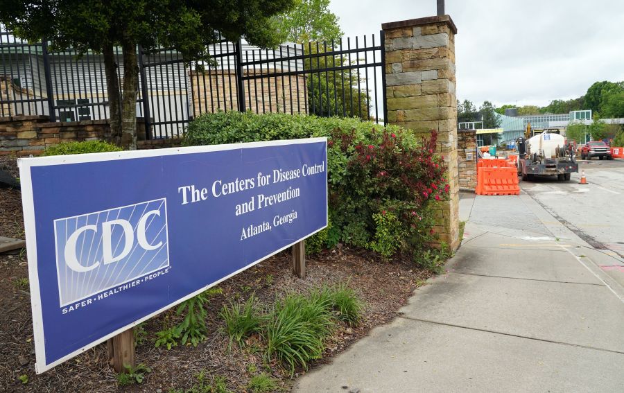 A sign is seen by the entrance of the Centers for Disease Control and Prevention in Atlanta, Georgia on April 23, 2020. (TAMI CHAPPELL/AFP via Getty Images)