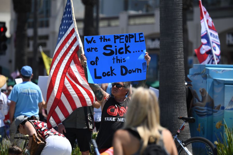 A demonstrator wearing a "CNN Fake News" T-Shirt protests against the state's stay-at-home order amid the coronavirus pandemic, on May 1, 2020, in California. (ROBYN BECK/AFP via Getty Images)