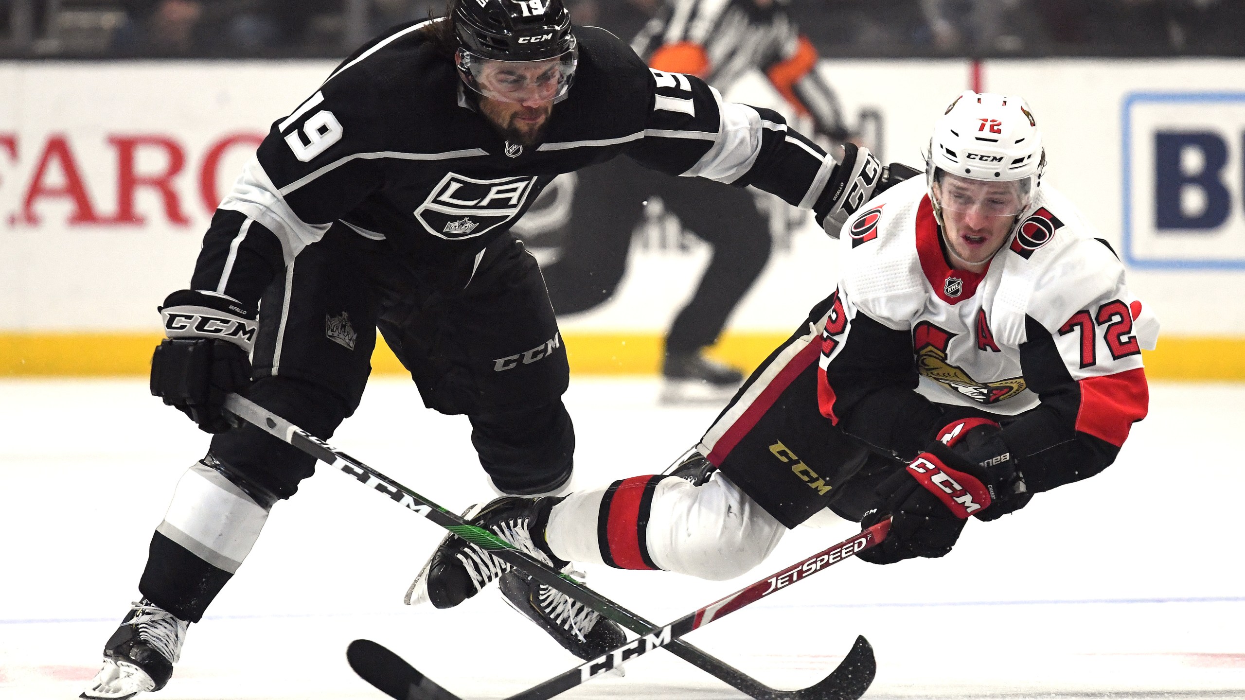 Thomas Chabot of the Ottawa Senators dives for a puck in front of Alex Iafallo of the Los Angeles Kings during the second period at Staples Center on March 11, 2020. (Harry How/Getty Images)