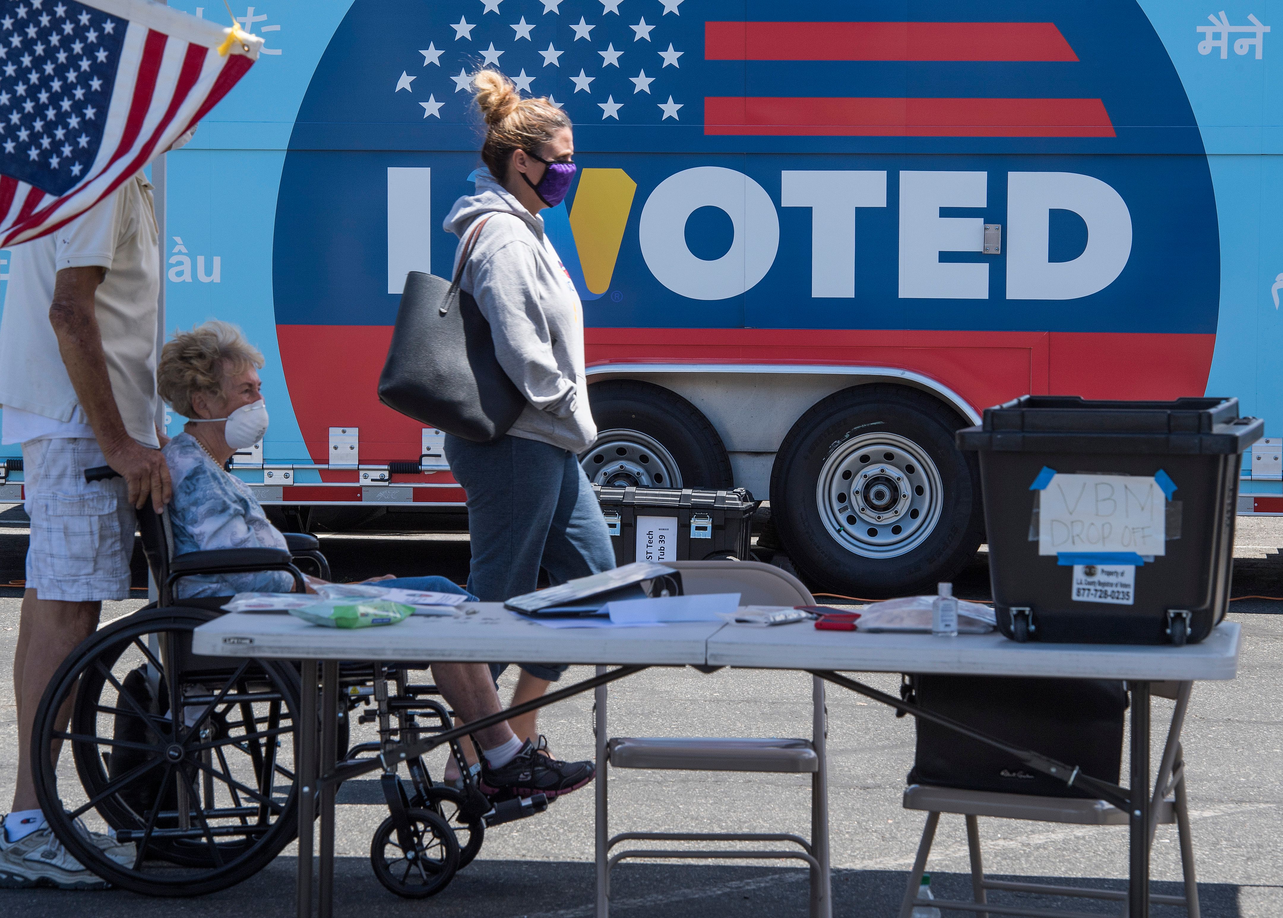 People wait to cast their votes at a polling station for the special election between Democratic state assemblywoman Christy Smith and Republican businessman and ex-Navy pilot Mike Garcia to replace former Democratic Congresswoman Katie Hill in the state's 25th Congressional District, in Santa Clarita, California on May 12, 2020. (MARK RALSTON/AFP via Getty Images)