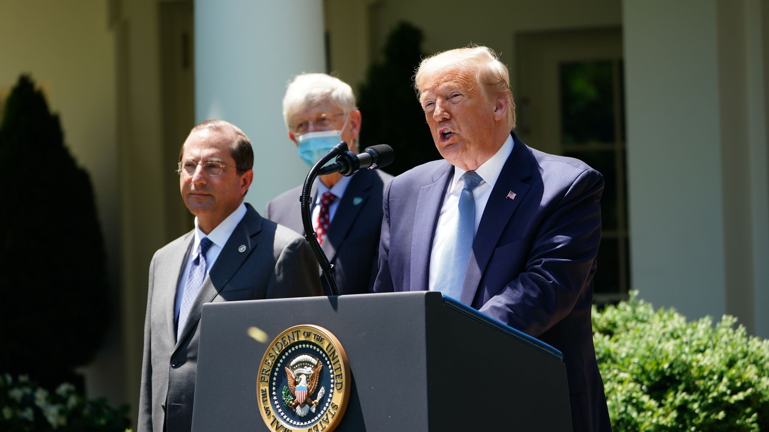 President Donald Trump, with US Secretary of Health and Human Services Alex Azar (L), speaks on vaccine development on May 15, 2020, in the Rose Garden of the White House in Washington, DC. (MANDEL NGAN/AFP via Getty Images)