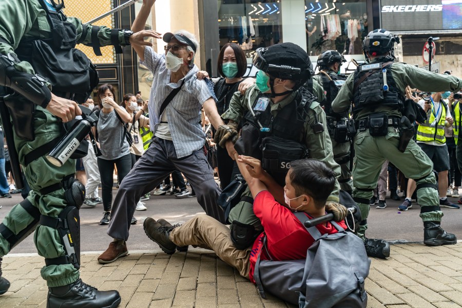 Pro-democracy supporters scuffle with riot police during an detention at a rally in Causeway Bay district on May 27, 2020 in Hong Kong, China. (Anthony Kwan/Getty Images)