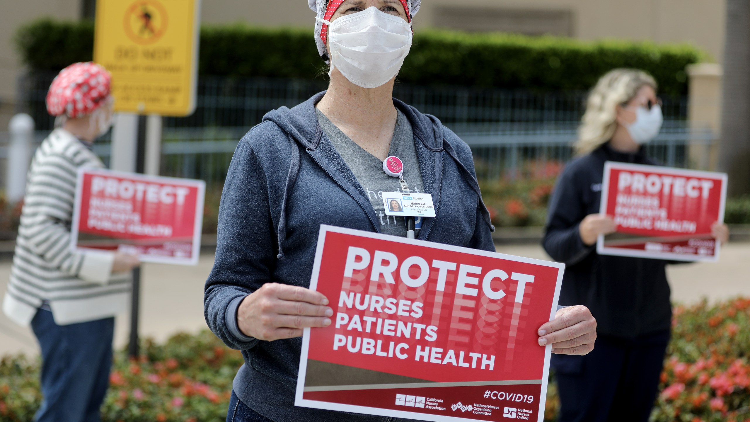 Registered nurses and health care workers protest what they say is a lack of personal protective equipment available for front-line workers at UCLA Medical Center in Santa Monica amid the coronavirus pandemic on April 13, 2020. (Credit: Mario Tama / Getty Images)