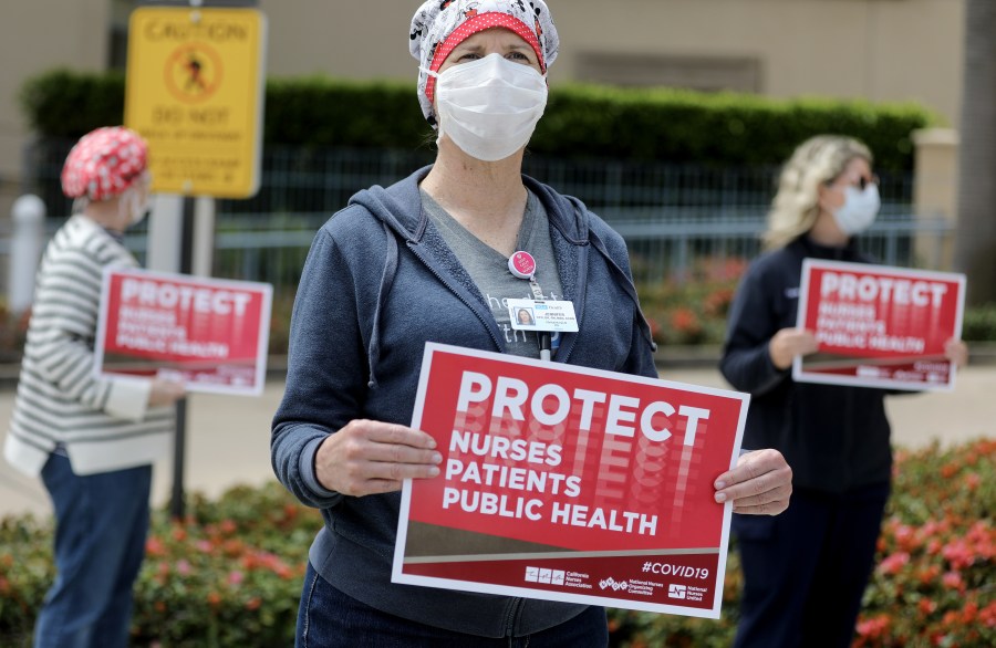 Registered nurses and health care workers protest what they say is a lack of personal protective equipment available for front-line workers at UCLA Medical Center in Santa Monica amid the coronavirus pandemic on April 13, 2020. (Credit: Mario Tama / Getty Images)