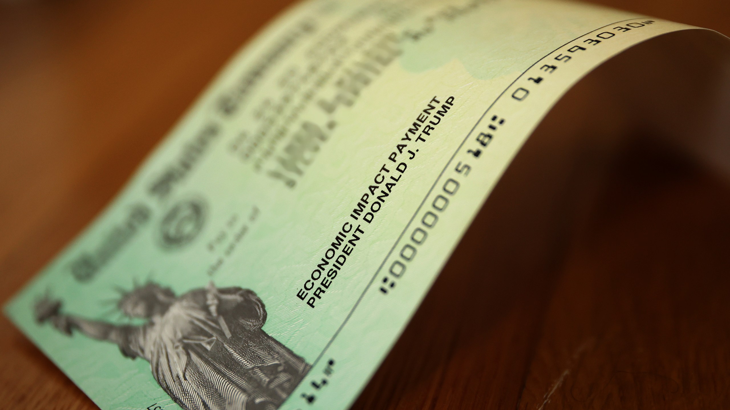 President Donald Trump's name appears on the coronavirus economic assistance checks that were sent to citizens across the country April 29, 2020 in Washington, DC. (Chip Somodevilla/Getty Images)