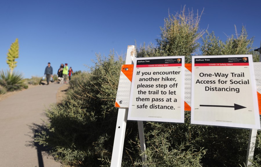 A trail is marked with social distancing signs in Joshua Tree National Park one day after the park reopened after being closed for two months due to the coronavirus pandemic on May 18, 2020, in Joshua Tree National Park, California. (Mario Tama/Getty Images)