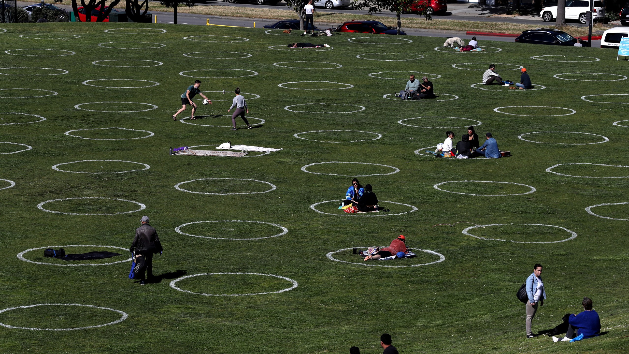 People sit in social distancing circles at Dolores Park on May 20, 2020 in San Francisco. (Justin Sullivan/Getty Images)