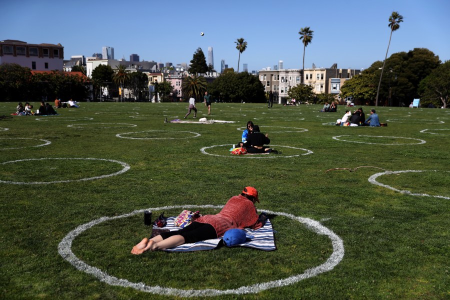 People sit in social distancing circles at Dolores Park on May 20, 2020, in San Francisco, California. (Justin Sullivan/Getty Images)