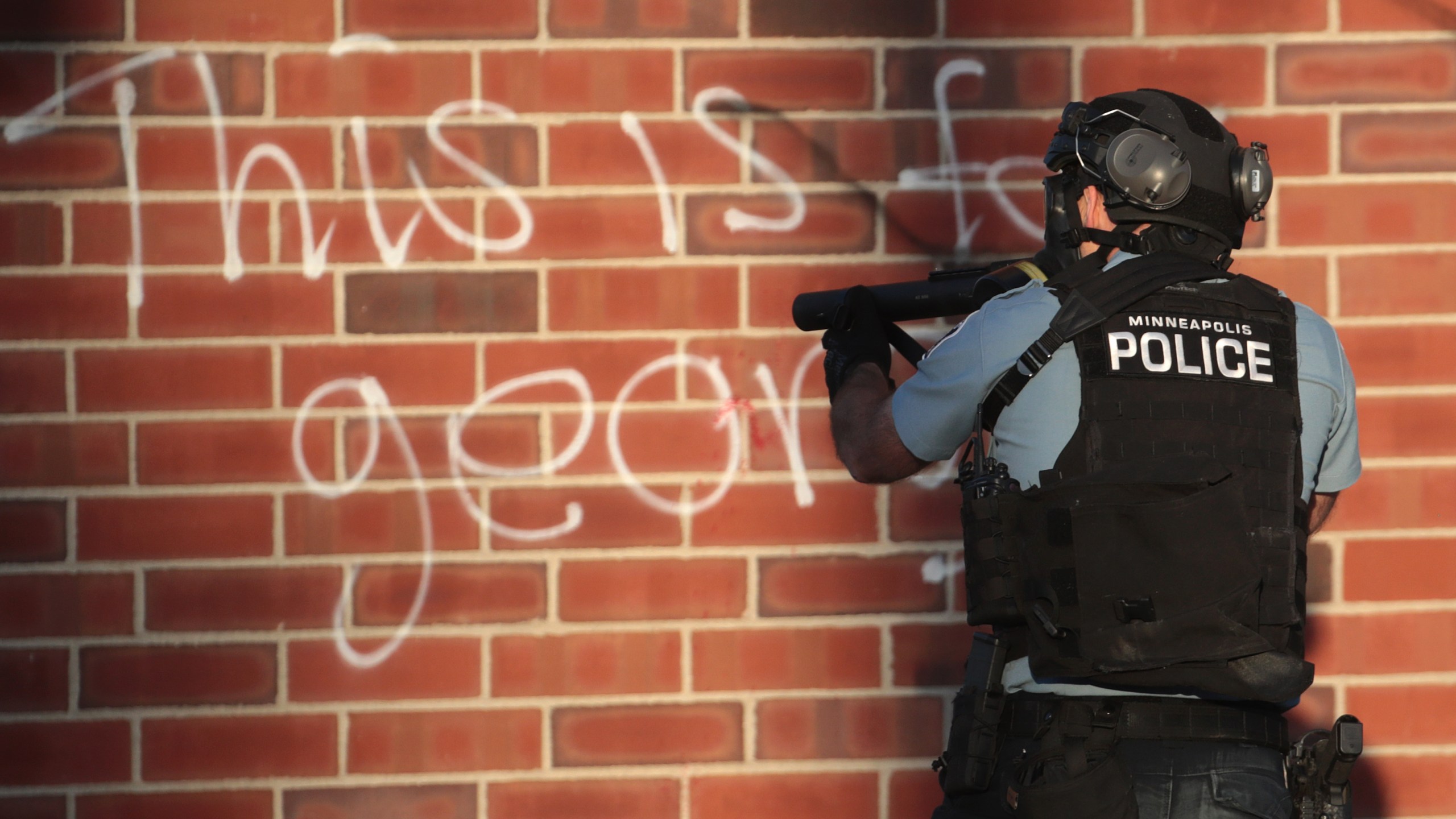 Police aim a tear gas gun during a protest on May 28, 2020, in St. Paul, Minnesota. (Scott Olson/Getty Images)