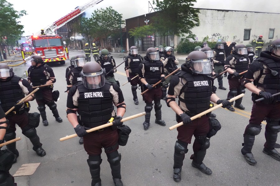 Police in Minneapolis, Minnesota secure a perimeter on May 29, 2020 following a night of rioting sparked by the death of George Floyd. (Photo by Scott Olson/Getty Images)