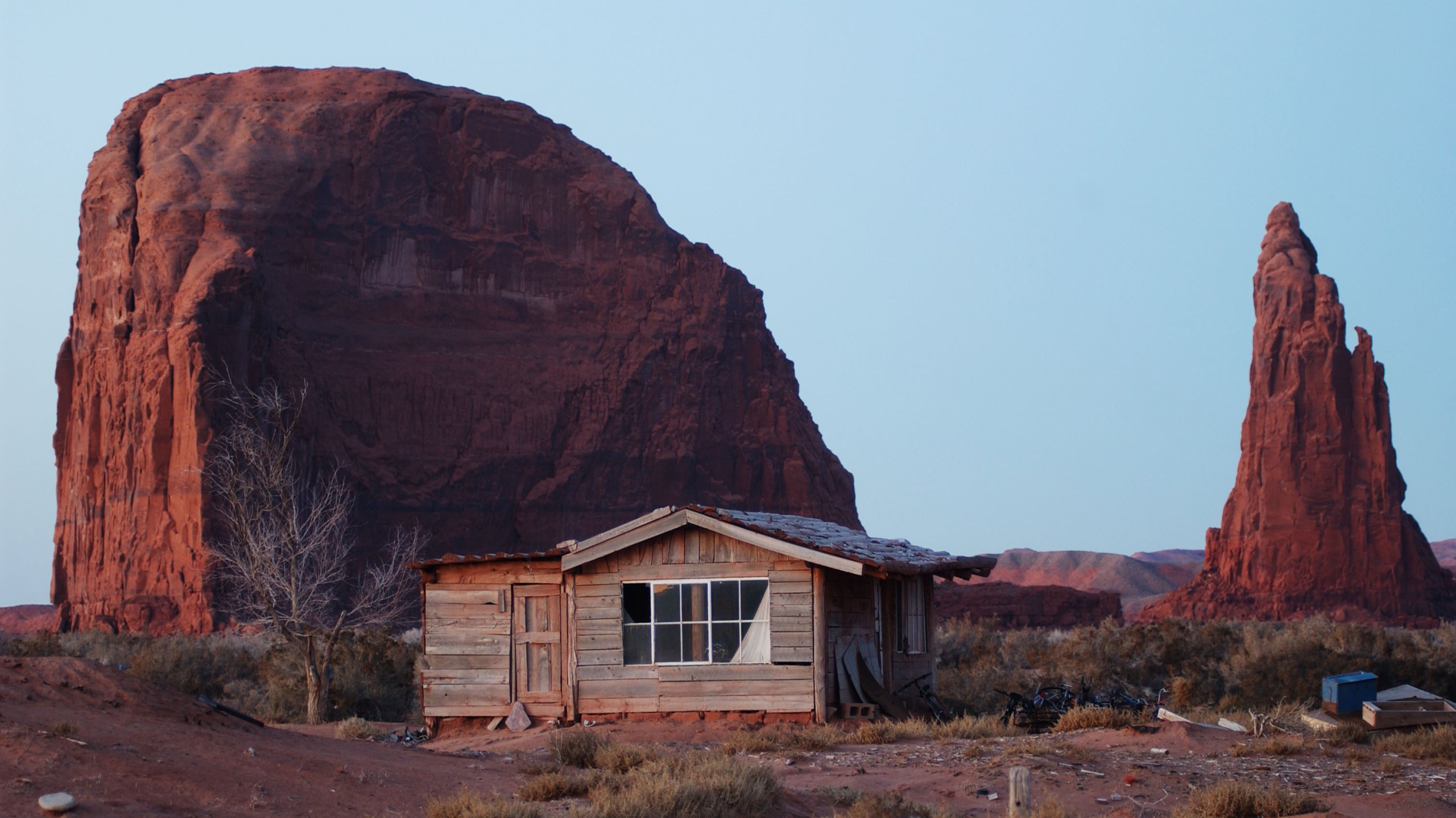 A house stands near sandstone formations south of Rock Point on the Navajo Reservation in Arizona on Dec. 5, 2002. (David McNew/Getty Images)