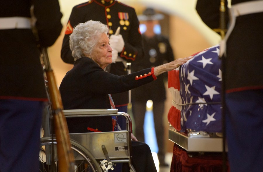 Annie Glenn, widow of former astronaut and Senator John Glenn, pays her respects to her late husband as he lies in repose, under a United States Marine honor guard, in the Rotunda of the Ohio Statehouse December 16, 2016 in Columbus, Ohio. (Bill Ingalls/NASA via Getty Images)