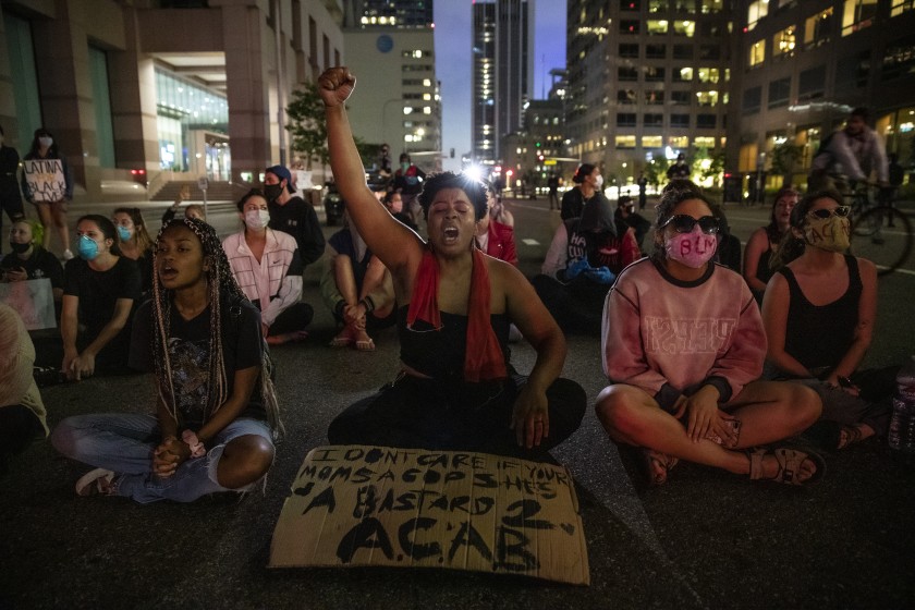 Elyssa Wells and others protest on Grand Avenue in downtown Los Angeles on May 28, 2020. (Robert Gauthier/Los Angeles Times)