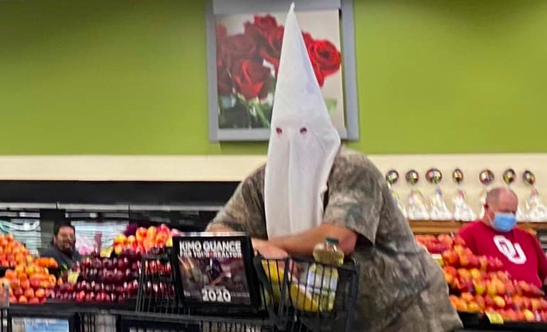 Facebook user Tiam Tellez posted this photo on May 2, 2020 of a man wearing a white hood at a grocery store in Santee.