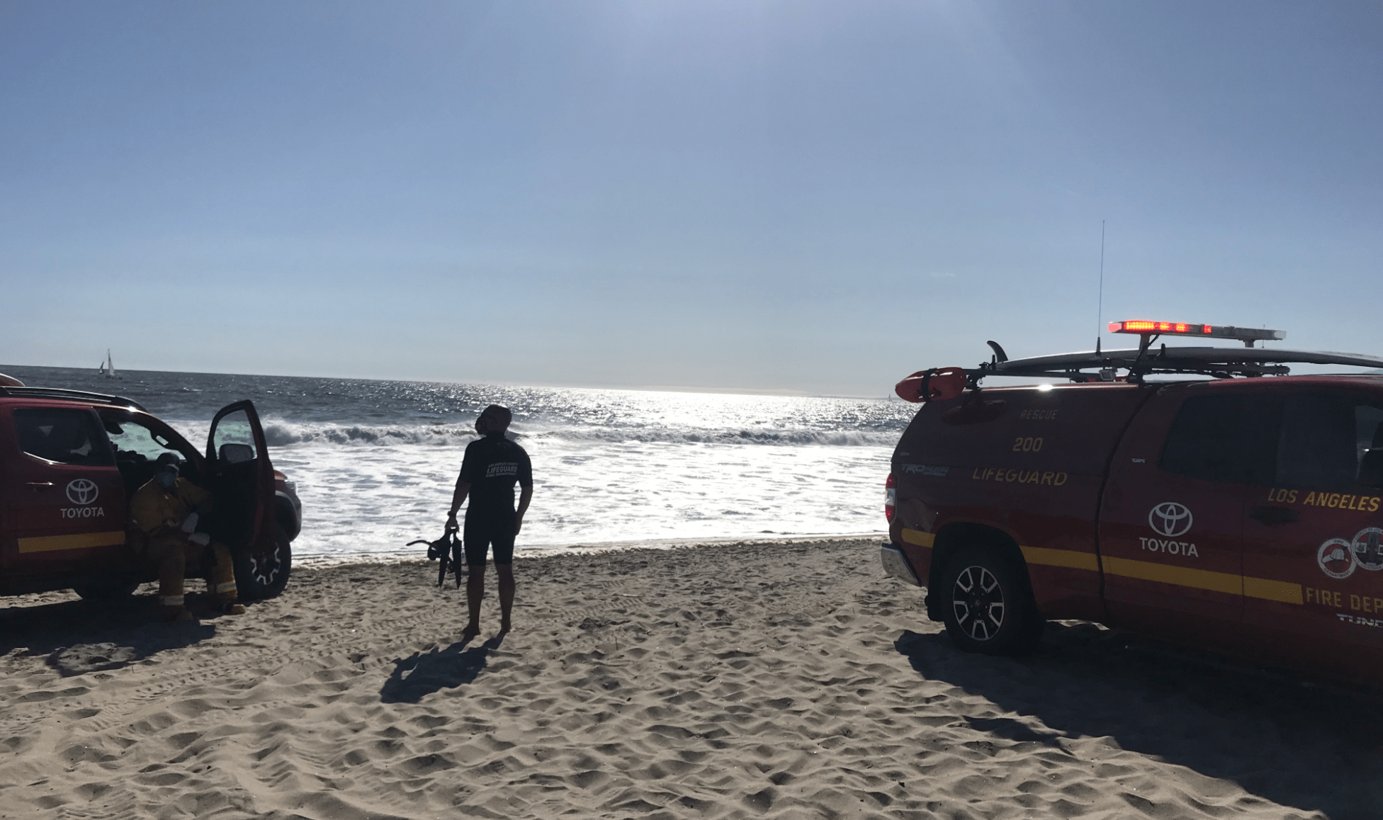 L.A. County lifeguards search for a missing man at Venice Beach on May 17, 2020.